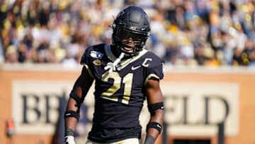 WINSTON SALEM, NORTH CAROLINA - NOVEMBER 02: Essang Bassey #21 of the Wake Forest Demon Deacons in the first half during their game against the North Carolina State Wolfpack at BB&T Field on November 02, 2019 in Winston Salem, North Carolina. (Photo by Jacob Kupferman/Getty Images)