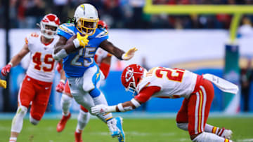 MEXICO CITY, MEXICO - NOVEMBER 18: Safety Juan Thornhill #22 of the Kansas City Chiefs tackles Running back Melvin Gordon #25 of Los Angeles Chargers during the first half of a match against Los Angeles Chargers at Estadio Azteca on November 18, 2019 in Mexico City, Mexico. (Photo by Manuel Velasquez/Getty Images)