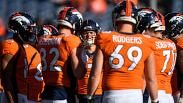 DENVER, CO - DECEMBER 29: Denver Broncos players huddle around Drew Lock #3 during warm up before a game against the Oakland Raiders at Empower Field at Mile High on December 29, 2019 in Denver, Colorado. (Photo by Dustin Bradford/Getty Images)