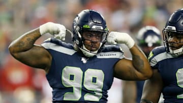SEATTLE, WASHINGTON - DECEMBER 29: Defensive tackle Quinton Jefferson #99 of the Seattle Seahawks celebrates sacking quarterback Jimmy Garoppolo #10 (not pictured) of the San Francisco 49ers during the first quarter of the game at CenturyLink Field on December 29, 2019 in Seattle, Washington. (Photo by Otto Greule Jr/Getty Images)