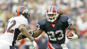 ORCHARD PARK, NY - SEPTEMBER 9: Marshawn Lynch #23 of the Buffalo Bills runs as Dre Bly #32 of the Denver Broncos defends at Ralph Wilson Stadium September 9, 2007 in Orchard Park, New York. Denver won 15-14. (Photo by Rick Stewart/Getty Images)