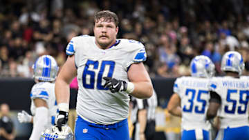 NEW ORLEANS, LA - OCTOBER 15: Graham Glasgow #60 of the Detroit Lions jogs off the field during a game against the New Orleans Saints at Mercedes-Benz Superdome on October 15, 2017 in New Orleans, Louisiana. The Saints defeated the Lions 52-38. (Photo by Wesley Hitt/Getty Images)
