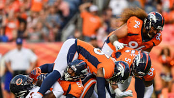 DENVER, CO - AUGUST 18: Denver Broncos defensive players, including linebacker Brandon Marshall #54, linebacker Von Miller #58, defensive back Darian Stewart #26, and defensive tackle Domata Sr. Peko #94 of the Denver Broncos tackle running back Jordan Howard #24 of the Chicago Bears for a loss inside the Bears 5 yard line int he first quarter during an NFL preseason game at Broncos Stadium at Mile High on August 18, 2018 in Denver, Colorado. (Photo by Dustin Bradford/Getty Images)