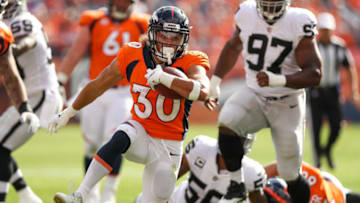 DENVER, CO - SEPTEMBER 16: Running back Phillip Lindsay #30 of the Denver Broncos rushes against the Oakland Raiders at Broncos Stadium at Mile High on September 16, 2018 in Denver, Colorado. (Photo by Matthew Stockman/Getty Images)