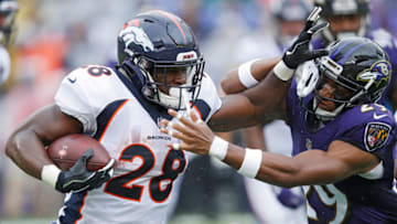 BALTIMORE, MD - SEPTEMBER 23: Royce Freeman #28 of the Denver Broncos runs the ball while defended by Marlon Humphrey #29 of the Baltimore Ravens in the first quarter of the game at M&T Bank Stadium on September 23, 2018 in Baltimore, Maryland. (Photo by Joe Robbins/Getty Images)