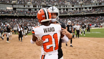 OAKLAND, CA - SEPTEMBER 30: Derek Carr #4 of the Oakland Raiders talks with Denzel Ward #21 of the Cleveland Browns after their game at Oakland-Alameda County Coliseum on September 30, 2018 in Oakland, California. (Photo by Ezra Shaw/Getty Images)