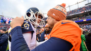 DENVER, CO - OCTOBER 14: Quarterback Jared Goff #16 of the Los Angeles Rams and quarterback Case Keenum #4 of the Denver Broncos shake hands on the field after the Rams' 23-20 win at Broncos Stadium at Mile High on October 14, 2018 in Denver, Colorado. (Photo by Dustin Bradford/Getty Images)