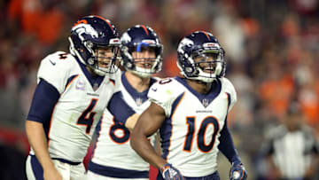 GLENDALE, AZ - OCTOBER 18: Wide receiver Emmanuel Sanders #10 and quarterback Case Keenum #4 of the Denver Broncos react after scoring a 64-yard touchdown during the second quarter against the Arizona Cardinals at State Farm Stadium on October 18, 2018 in Glendale, Arizona. (Photo by Christian Petersen/Getty Images)