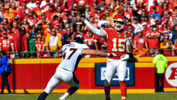 KANSAS CITY, MO - OCTOBER 28: Patrick Mahomes #15 of the Kansas City Chiefs throws a pass in the pocket with heavy pressure from Josey Jewell #47 of the Denver Broncos during the first half of the game at Arrowhead Stadium on October 28, 2018 in Kansas City, Missouri. (Photo by Peter Aiken/Getty Images)