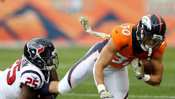 DENVER, CO - NOVEMBER 04: Phillip Lindsay #30 of the Denver Broncos is tackled by Kareem Jackson #25 the Houston Texans at Broncos Stadium at Mile High on November 4, 2018 in Denver, Colorado. (Photo by Matthew Stockman/Getty Images)