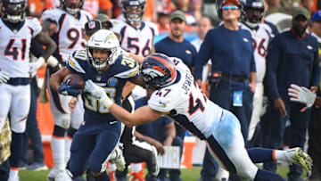 CARSON, CA - NOVEMBER 18: Inside linebacker Joey Jewell #47 of the Denver Broncos tackles running back Austin Ekeler #30 of the Los Angeles Chargers in the fourth quarter at StubHub Center on November 18, 2018 in Carson, California. (Photo by Jayne Kamin-Oncea/Getty Images)
