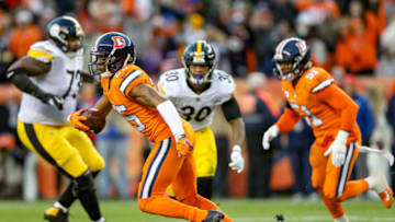 DENVER, CO - NOVEMBER 25: Cornerback Chris Harris #25 of the Denver Broncos carries the ball after intercepting a pass intended for wide receiver Antonio Brown (not pictured) of the Pittsburgh Steelers in the third quarter of a game at Broncos Stadium at Mile High on November 25, 2018 in Denver, Colorado. (Photo by Matthew Stockman/Getty Images)