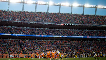 DENVER, CO - NOVEMBER 25: Quarterback Case Keenum #4 of the Denver Broncos hands the ball to running back Phillip Lindsay #30 in a general view during the third quarter of a game at Broncos Stadium at Mile High on November 25, 2018 in Denver, Colorado. (Photo by Justin Edmonds/Getty Images)