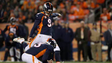 DENVER, COLORADO - DECEMBER 15: Colby Wadman #3 holds as Brandon McManus #8 of the Denver Broncos kicks a field goal against the Cleveland Browns at Broncos Stadium at Mile High on December 15, 2018 in Denver, Colorado. (Photo by Matthew Stockman/Getty Images)