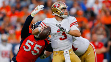 DENVER, CO - AUGUST 19: Outside linebacker Bradley Chubb #55 of the Denver Broncos strips the football away from quarterback C.J. Beathard #3 of the San Francisco 49ers during the second quarter of a preseason game at Broncos Stadium at Mile High on August 19, 2019 in Denver, Colorado. (Photo by Justin Edmonds/Getty Images)