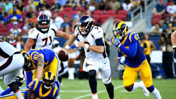 LOS ANGELES, CA - AUGUST 24: Quarterback Kevin Hogan #9 of the Denver Broncos rushes out of the pocket during the first half of their pre season football against Los Angeles Rams game at Los Angeles Memorial Coliseum on August 24, 2019 in Los Angeles, California. (Photo by Kevork Djansezian/Getty Images)