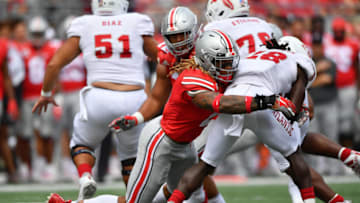 COLUMBUS, OH - AUGUST 31: Chase Young #2 of the Ohio State Buckeyes drops James Charles #28 of the Florida Atlantic Owls for a loss in the second quarter at Ohio Stadium on August 31, 2019 in Columbus, Ohio. (Photo by Jamie Sabau/Getty Images)