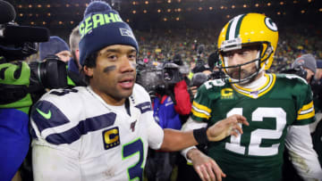 Denver Broncos 2022 offsesaon: Russell Wilson #3 of the Seattle Seahawks greets Aaron Rodgers #12 of the Green Bay Packers after the Packers defeated the Seahawks 28-23 in the NFC Divisional Playoff game at Lambeau Field on January 12, 2020 in Green Bay, Wisconsin. (Photo by Gregory Shamus/Getty Images)