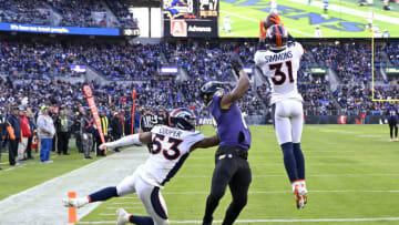 BALTIMORE, MARYLAND - DECEMBER 04: Justin Simmons #31 of the Denver Broncos intercepts a pass in the fourth quarter of a game against the Baltimore Ravens at M&T Bank Stadium on December 04, 2022 in Baltimore, Maryland. (Photo by Greg Fiume/Getty Images)