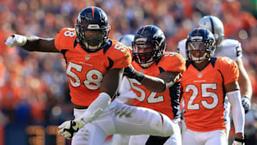 DENVER, CO - SEPTEMBER 30: Outside linebacker Von Miller #58 of the Denver Broncos celebrates with outside linebacker Wesley Woodyard #52 and strong safety Chris Harris #25 of the Denver Broncos after he tackled running back Darren McFadden #20 of the Oakland Raiders to bring up a fourth down at Sports Authority Field at Mile High on September 30, 2012 in Denver, Colorado. The Broncos defeated the Raiders 37-6. (Photo by Doug Pensinger/Getty Images)