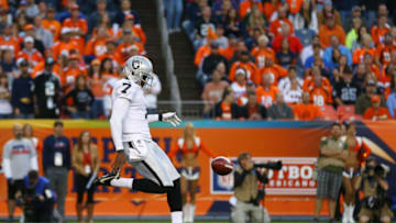 DENVER, CO - SEPTEMBER 23: Marquette King #7 of the Oakland Raiders punts the ball against the Denver Broncos at Sports Authority Field Field at Mile High on September 23, 2013 in Denver, Colorado. (Photo by Justin Edmonds/Getty Images)