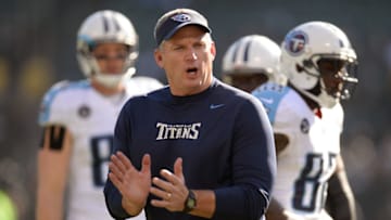 OAKLAND, CA - NOVEMBER 24: Head Coach Mike Munchak of the Tennessee Titans watches his team warm up prior to playing the Oakland Raiders at O.co Coliseum on November 24, 2013 in Oakland, California. (Photo by Thearon W. Henderson/Getty Images)