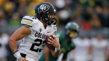 EUGENE, OR - NOVEMBER 22: Kick returner Phillip Lindsay #23 of the Colorado Buffaloes rushes against the Oregon Ducks at Autzen Stadium on November 22, 2014 in Eugene, Oregon. (Photo by Otto Greule Jr/Getty Images)