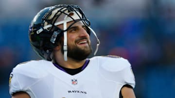 FOXBORO, MA - JANUARY 10: Gino Gradkowski #66 of the Baltimore Ravens looks on in warm ups before the 2014 AFC Divisional Playoffs game against the New England Patriots at Gillette Stadium on January 10, 2015 in Foxboro, Massachusetts. (Photo by Jim Rogash/Getty Images)