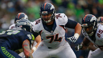 SEATTLE, WA - AUGUST 14: Tackle Ty Sambrailo #74 of the Denver Broncos battles defensive end Cassius Marsh #91 of the Seattle Seahawks at CenturyLink Field on August 14, 2015 in Seattle, Washington. (Photo by Otto Greule Jr/Getty Images)