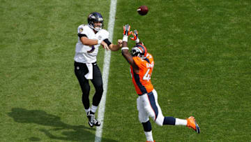 DENVER, CO - SEPTEMBER 13: Quarterback Joe Flacco #5 of the Baltimore Ravens gets off a pass against linebacker Shaquil Barrett #48 of the Denver Broncos at Sports Authority Field at Mile High on September 13, 2015 in Denver, Colorado. The Broncos defeated the Ravens 19-13. (Photo by Doug Pensinger/Getty Images)