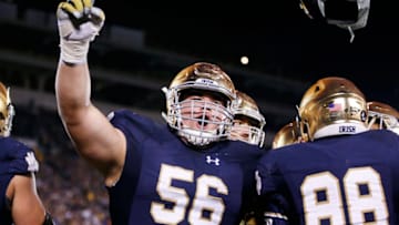 SOUTH BEND, IN - OCTOBER 17: Quenton Nelson #56 of the Notre Dame Fighting Irish celebrates after a 10-yard touchdown reception by Corey Robinson against the USC Trojans in the fourth quarter of the game at Notre Dame Stadium on October 17, 2015 in South Bend, Indiana. (Photo by Joe Robbins/Getty Images)