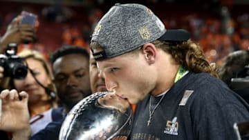 SANTA CLARA, CA - FEBRUARY 07: Jordan Taylor of the Denver Broncos kisses the Vince Lombardi Trophy after defeating the Carolina Panthers during Super Bowl 50 at Levi's Stadium on February 7, 2016 in Santa Clara, California. The Broncos defeated the Panthers 24-10. (Photo by Patrick Smith/Getty Images)