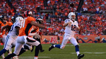 DENVER, CO - SEPTEMBER 18: Quarterback Andrew Luck #12 of the Indianapolis Colts throws to avoid a sack in the fourth quarter of the game against the Denver Broncos at Sports Authority Field at Mile High on September 18, 2016 in Denver, Colorado. (Photo by Dustin Bradford/Getty Images)