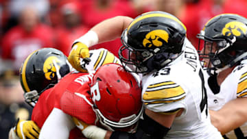 PISCATAWAY, NJ - SEPTEMBER 24: Chris Laviano #5 of the Rutgers Scarlet Knights carries the ball as Josey Jewell #43 of the Iowa Hawkeyes defends at High Point Solutions Stadium on September 24, 2016 in Piscataway, New Jersey. (Photo by Elsa/Getty Images)