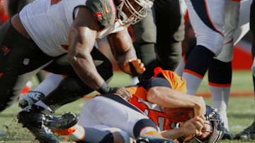 TAMPA, FL - OCTOBER 2: Clinton McDonald #98 of the Tampa Bay Buccaneers slams Trevor Siemian #13 of the Denver Broncos for a sack late in the second quarter during their game at Raymond James Stadium on October 2, 2016 in Tampa, Florida. (Photo by Joseph Garnett Jr. /Getty Images)