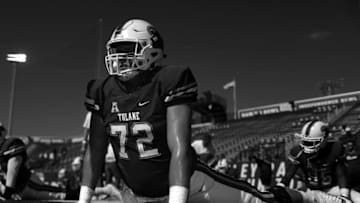 NEW ORLEANS, LA - OCTOBER 29: (Editors note: Image has been converted to black and white) John Leglue #72 of the Tulane Green Wave stretches before a game against the Sam Houston State Bearkats at Yulman Stadium on October 29, 2016 in New Orleans, Louisiana. (Photo by Jonathan Bachman/Getty Images)