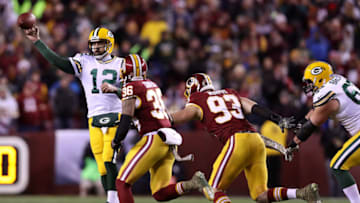 LANDOVER, MD - NOVEMBER 20: Quarterback Aaron Rodgers #12 of the Green Bay Packers passes the ball while under pressure by inside linebacker Su'a Cravens #36 and defensive end Trent Murphy #93 of the Washington Redskins in the second quarter at FedExField on November 20, 2016 in Landover, Maryland. (Photo by Rob Carr/Getty Images)