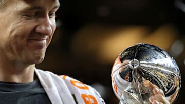 SANTA CLARA, CA - FEBRUARY 07: Peyton Manning #18 of the Denver Broncos celebrates with the Vince Lombardi Trophy after Super Bowl 50 at Levi's Stadium on February 7, 2016 in Santa Clara, California. The Broncos defeated the Panthers 24-10. (Photo by Patrick Smith/Getty Images)