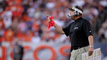 DENVER - SEPTEMBER 21: Head coach Sean Payton of the New Orleans Saints prepares to throw the red flag as he leads his team against the Denver Broncos during NFL action at Invesco Field at Mile High on September 21, 2008 in Denver, Colorado. The Broncos defeated the Saints 34-32. (Photo by Doug Pensinger/Getty Images)