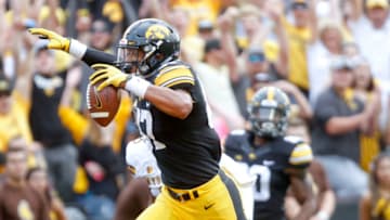 IOWA CITY, IOWA- SEPTEMBER 2: Tight end Noah Fant #87 of the Iowa Hawkeyes runs in for a touchdown after a catch in the second quarter in front of cornerback Tyler Hall #9 of the Wyoming Cowboys on September 2, 2017 at Kinnick Stadium in Iowa City, Iowa. (Photo by Matthew Holst/Getty Images)