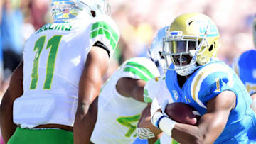 PASADENA, CA - OCTOBER 21: Soso Jamabo #1 of the UCLA Bruins scores a touchdown for a 7-0 lead in front of Justin Hollins #11 of the Oregon Ducks during the first half at Rose Bowl on October 21, 2017 in Pasadena, California. (Photo by Harry How/Getty Images)