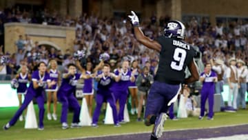 FORT WORTH, TX - OCTOBER 21: John Diarse #9 of the TCU Horned Frogs celebrates after scoring a touchdown against the Kansas Jayhawks in the first half at Amon G. Carter Stadium on October 21, 2017 in Fort Worth, Texas. (Photo by Tom Pennington/Getty Images)