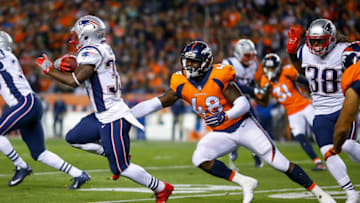 DENVER, CO - NOVEMBER 12: Running back Dion Lewis #33 of the New England Patriots avoids a tackle attempt by outside linebacker Shaquil Barrett #48 of the Denver Broncos returns a kickoff for a first quarter touchdown against the Denver Broncos at Sports Authority Field at Mile High on November 12, 2017 in Denver, Colorado. (Photo by Justin Edmonds/Getty Images)