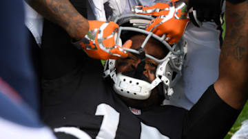 OAKLAND, CA - NOVEMBER 26: Michael Crabtree #15 of the Oakland Raiders has his helmet pulled off during a fight with Aqib Talib #21 of the Denver Broncos in their NFL game at Oakland-Alameda County Coliseum on November 26, 2017 in Oakland, California. Both players were ejected from the game. (Photo by Robert Reiners/Getty Images)