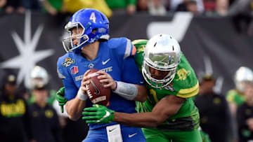 LAS VEGAS, NV - DECEMBER 16: Quaterback Brett Rypien #4 of the Boise State Broncos looks on under pressure from Justin Hollins #11 of the Oregon Ducks during the Las Vegas Bowl at Sam Boyd Stadium on December 16, 2017 in Las Vegas, Nevada. Boise State won 38-28. (Photo by David Becker/Getty Images)