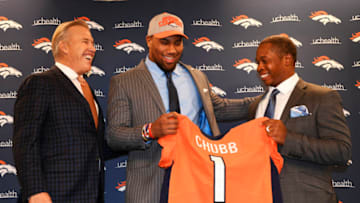ENGLEWOOD, CO - APRIL 27: President of Football Operations/General Manager John Elway, left, and Denver Broncos head coach Vance Joseph, right, present their 1st round draft pick Bradley Chubb, center, with a Broncos jersey at Dove Valley April 27, 2018. (Photo by Andy Cross/The Denver Post via Getty Images)