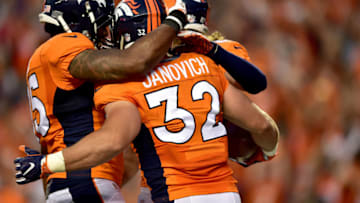 DENVER, CO - SEPTEMBER 08: Fullback Andy Janovich #32 of the Denver Broncos celebrates with teammates after he scores on a 28-yard touchdown run against the Carolina Panthers in the second quarter at Sports Authority Field at Mile High on September 8, 2016 in Denver, Colorado. (Photo by Dustin Bradford/Getty Images)