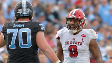 CHAPEL HILL, NC - NOVEMBER 25: Bradley Chubb #9 of the North Carolina State Wolfpack has words for Caleb Peterson #70 of the North Carolina Tar Heels during their game at Kenan Stadium on November 25, 2016 in Chapel Hill, North Carolina. North Carolina State won 28-21. (Photo by Grant Halverson/Getty Images)