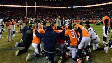 DENVER, CO - JANUARY 1: Denver Broncos players huddle together after defeating the Oakland Raiders 24-6 at Sports Authority Field at Mile High on January 1, 2017 in Denver, Colorado. (Photo by Dustin Bradford/Getty Images)