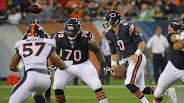 CHICAGO, IL - AUGUST 10: The ball sails over Mike Glennon #8 of the Chicago Bears on a bad snap as Bobby Massie #70 moves to block DeMarcus Walker #57 of the Denver Broncos during a preseason game at Soldier Field on August 10, 2017 in Chicago, Illinois. The Broncos defeated the Bears 24-17. (Photo by Jonathan Daniel/Getty Images)